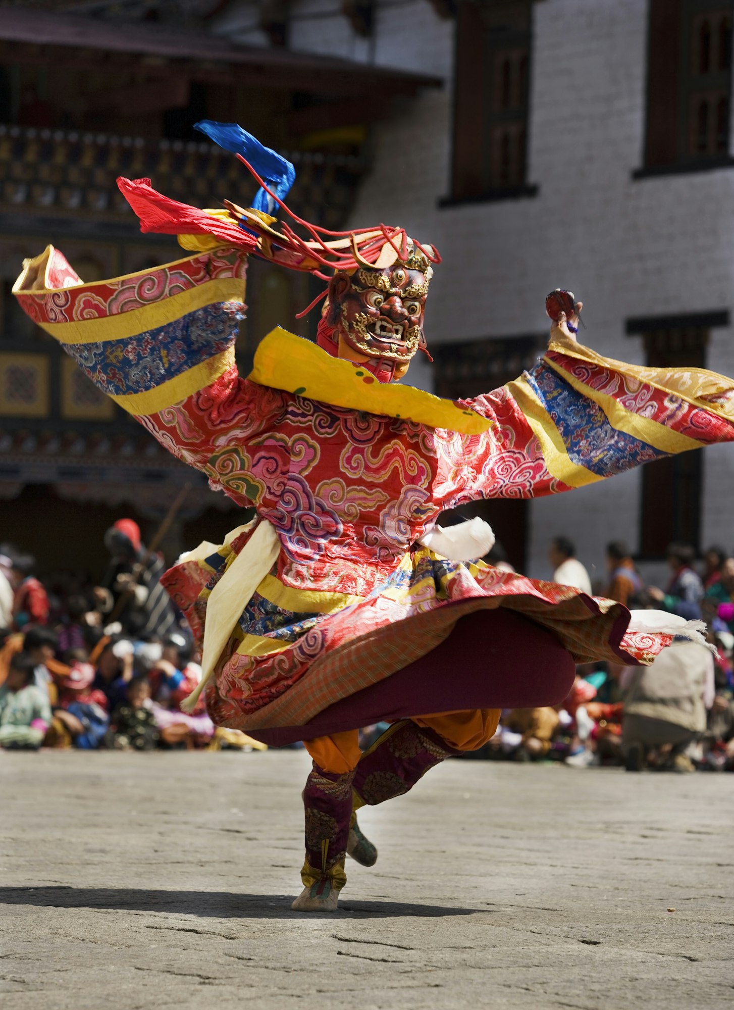 Masked performer dancing at festival, Punakha, Bhutan